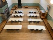 Classroom style set up. 24 chairs with tables